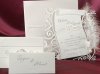    Esküvői meghívó -150x150 mm -átlátszó műanyag hátlap fehér csillámdíszítéssel - kivágásba illeszthető fehér formastancolt betétlappal - szívalakú gyönggyel és fehér tollal