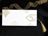      Esküvői meghívó - 220x100 mm - tasak: krémszínű papír, aranyozással - betétlap: arany zsinórral kihúzható