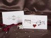    Esküvői meghívó - 165x95 mm - felfelé 3 részre nyitható -fekete és piros mintával, aranyozással, domborítással - ablakos - záródása szív alakú kivágásnál - boríték nélkül