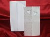 Esküvői meghívó - 110x190 mm - középen szétnyitható - elején gyöngyházfényű karton, aranyozással, ablakkivágással - összahajtás után kis szalaggal átköthető - boríték: fehér matt