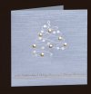 Karácsonyi üdvözlőlap - 135x135 mm - oldalra nyitható - ezüst gyöngyházfényű karton - ezüst és arany fóliadíszítéssel, domborítással